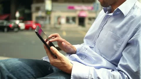 Man hands with tablet computer in the city HD Stock Footage 10860056