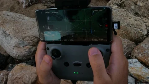 Man hands take rc drone controller and cotrol it Stock Footage 156565920