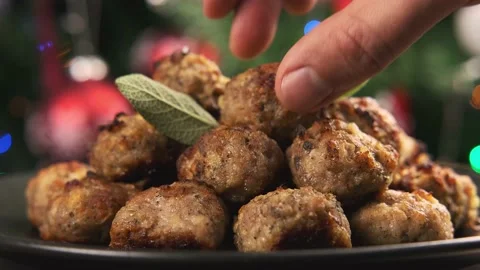 Man hands taking Pork stuffing meatballs. Christmas, decoration, gifts, green Stock Footage 144050354