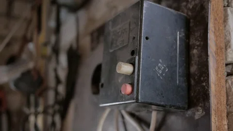 Man hands turning switch in a electricity, power shield. Electrical commutation Stock Footage 73337136