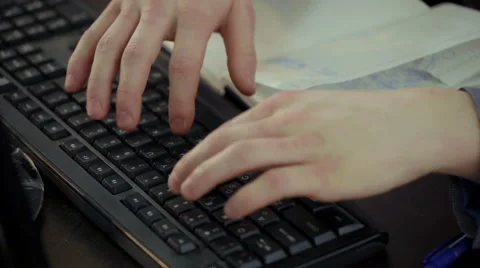 Man hands typing on computer keyboard Stock Footage 58010917