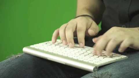 Man hands typing on a computer keyboard. Green box. Stock Footage 76393911
