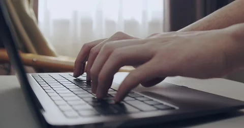 Man hands typing on laptop computer in his room Video stock 150036963