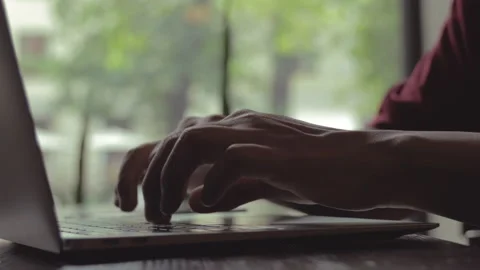 Man hands typing on laptop computer keyboard sit at home Stock Footage 156842359