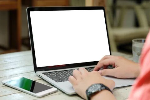 Man hands typing laptop computer with blank screen for mock up template backg Stock Photos