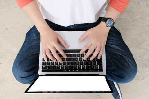 Man hands typing laptop computer with blank screen for mock up template backg Stock Photos
