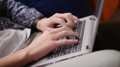 Man hands typing on laptop keyboard close-up Stock Footage 125238525
