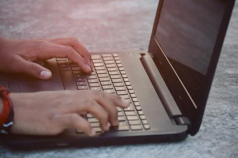 Man hands typing on laptop keyboard 写真素材
