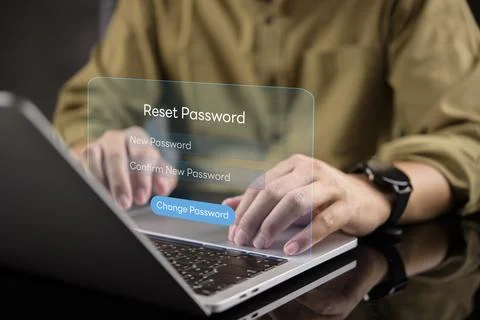 Man hands typing on laptop with virtual password reset interface. Concept o.. Stock Photos