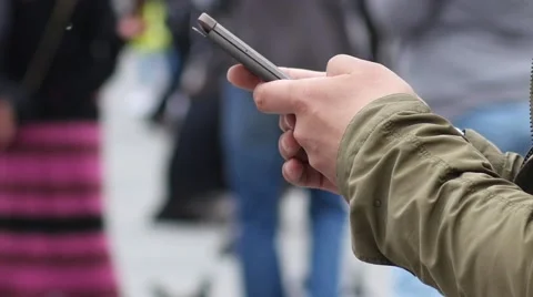 Man hands typing smart phone chatting messenger social media in public place Stock Footage 63389998