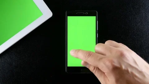 Man hands typing on smartphone green screen Stock Footage 76876438