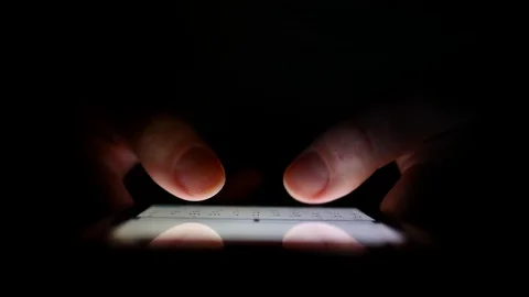 Man Hands Typing text on smartphone at night.	 Stock Footage 124420356