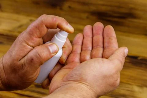 Man hands using hand sanitizer. Concept of coronavirus prevention Stock Photos