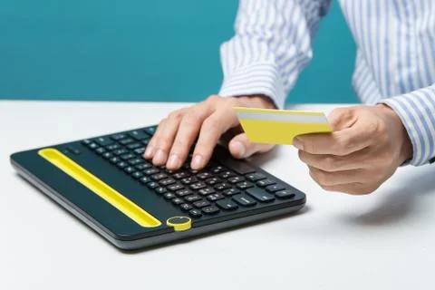 Man hands using keyboard and holding credit card with social media as Onlin.. Stock Photos