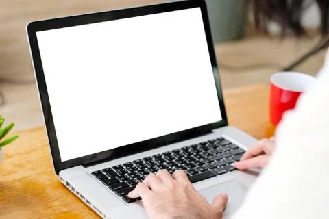 Man hands using laptop computer with blank screen for mock up template backgr Stock Photos