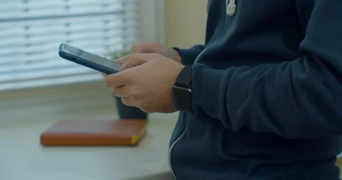 Man hands using a smart phone, close up. Young man holding mobile smart phone Stock Footage 123932906