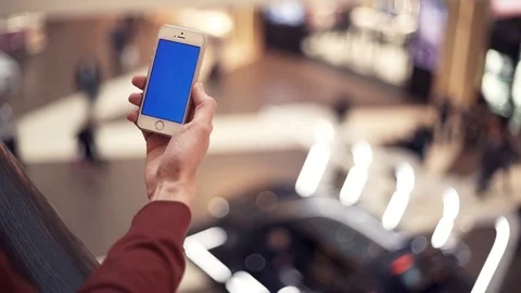 Man hands using smartphone with chroma screen in shopping center Stock Footage 82990170