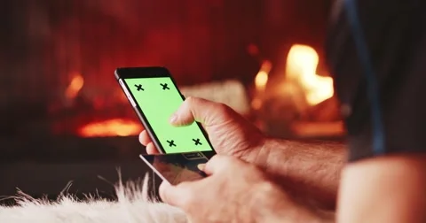 Man Hands Using SmartPhone, online shopping by Fireplace. 4K SLOW MOTION 스톡 동영상 69261234