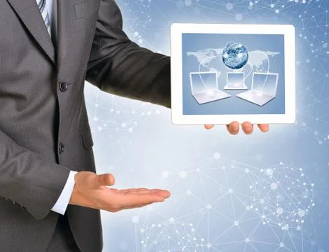 Man hands using tablet pc. Image of Earth and laptops on screen Illustrazione stock