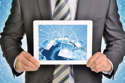Man hands using tablet pc. Image of Earth and laptops on screen Stock Illustration