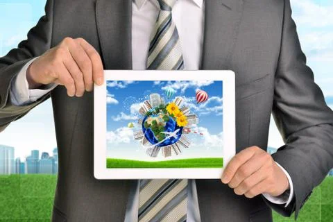 Man hands using tablet pc. Image of Earth and buildings on screen Illustrazione stock