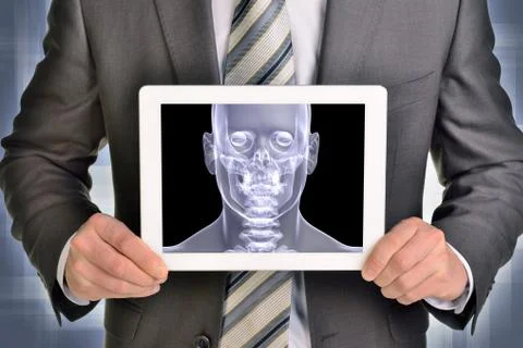 Man hands using tablet pc. Image of x-ray head on screen Illustrazione stock