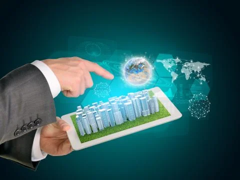 Man hands using tablet pc. Business city on touch screen. Earth near computer Stock Photos