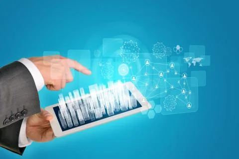 Man hands using tablet pc. Wire-frame buildings on touch screen. Virtual element Stock Photos