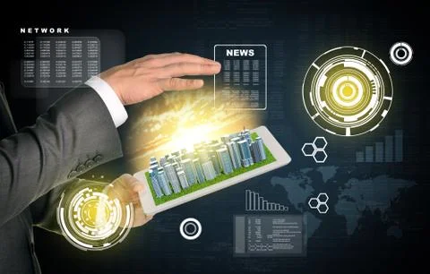 Man hands using tablet pc. Business city on touch screen. Virtual elements near Stock Photos