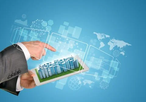 Man hands using tablet pc. Business city on touch screen Stock Photos