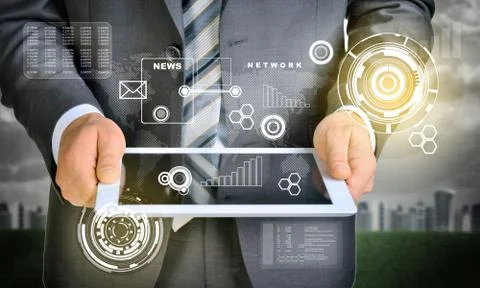 Man hands using tablet. Virtual elements near computer Foto stock