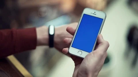 Man hands using telephone with chroma screen in shopping mall Stock Footage 82989938