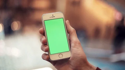 Man hands using telephone with green screen in shopping mall Stock Footage 82990340
