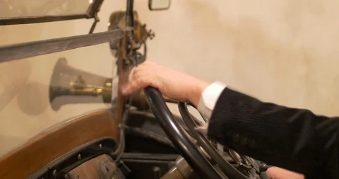 Man hands on a very old car steering wheel  Stock Footage 106527775