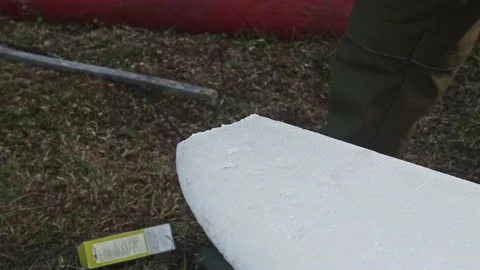Man hands who repairs drone wing. Man glues a piece of foam plastic to wing. Video stock 171921905