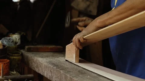 Man Hands working on the Construction of a Traditional Paraguayan Harp. Stock Footage 96017851
