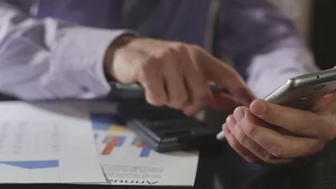 Man hands working with documents with graphs Stock Footage 72814793