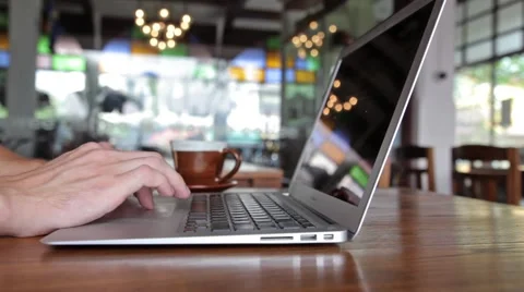 Man hands working on laptop computer in cafe Stock Footage 49715049