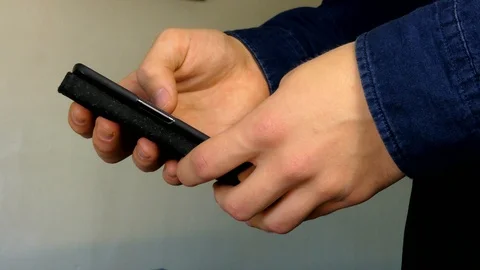Man Hands Working With A Smartphone Indoors Stock-Footage 99863938