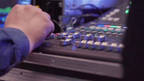 Man hands working on sound device tuning speaker voice via sliders Stock Footage 172199600
