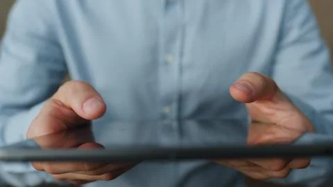 Man hands working tablet close up. Unknown businessman holding tab computer. Foto stock