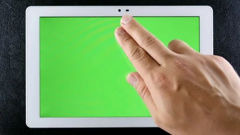 Man hands working on tablet green screen Stock Footage 76878330