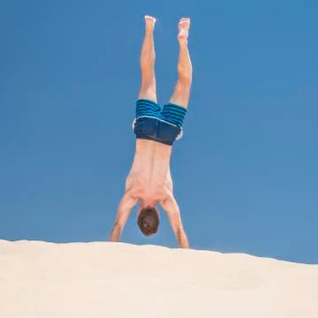 Man handstanding Stock Photos