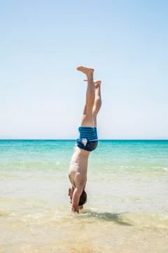 Man handstanding Stock Photos