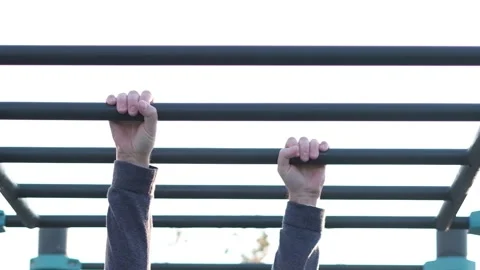 Man hanging in horizontal bar moving ahead. Stock Footage 116518650