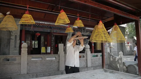 Man hanging incense in the temple ,Xi'an city, Shaanxi province, china. Stock Footage 37973282