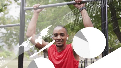 Man hanging on pullup bar in park, holding while animated charts sliding in Stock Footage 333278290