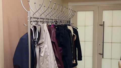 A man is hangng the jacket on a hanger Stock Footage 67351960