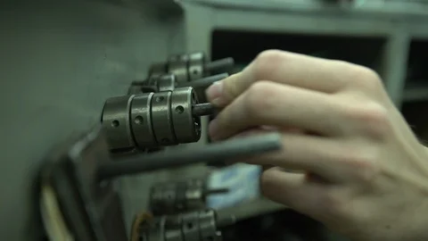 Man hangs bolts on nails Stock Footage 122245270