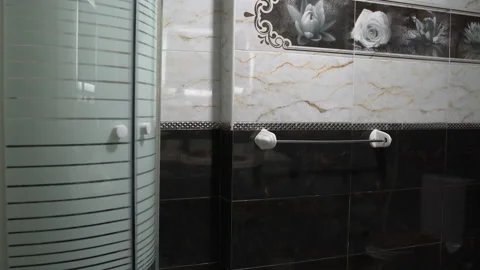 A man hangs a towel in the bathroom Stock-Footage 101585960